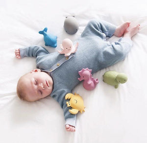 Sleeping Baby with Tikiri Rubber Toys
